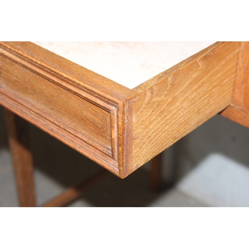 46 - An early 20th century oak side table with 2 drawers, approx 106cm wide x 47cm deep x 72cm tall