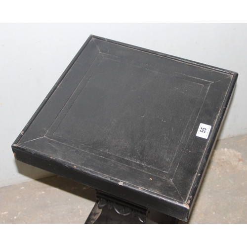 55 - An unusual black painted pedestal or stand with carved details, approx 40cm wide x 40cm deep x 63cm ... 