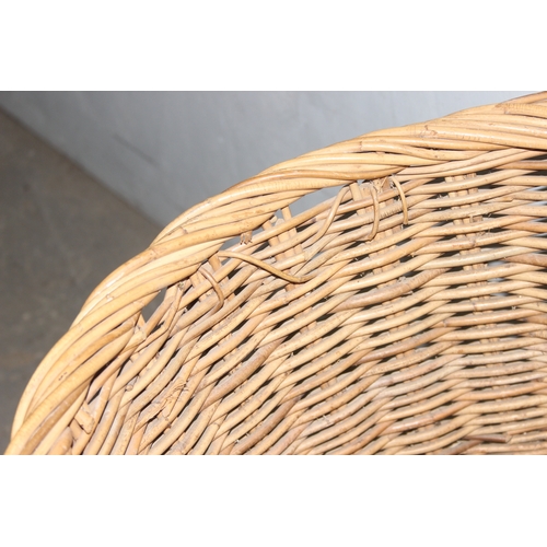 56 - A large vintage wicker log basket, approx 58cm x 58cm excluding handle