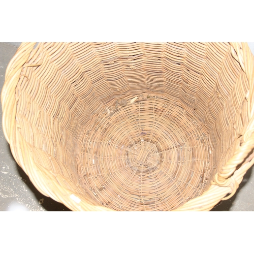 56 - A large vintage wicker log basket, approx 58cm x 58cm excluding handle