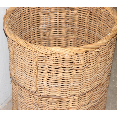 56 - A large vintage wicker log basket, approx 58cm x 58cm excluding handle