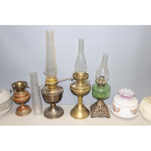 230 - Qty of assorted vintage oil lamps/parts, tallest approx 61cm