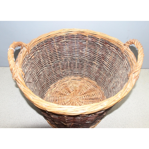 274 - Wicker log basket with handles, approx 50 x 50 x 35cm