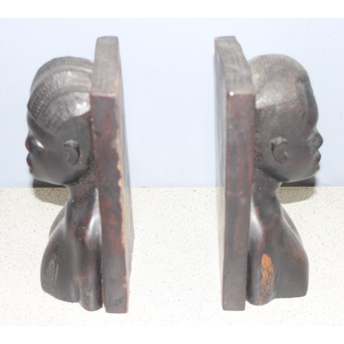 275 - Pair of carved ebony African bust bookends, approx 24cm H