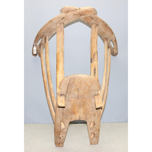 277 - A vintage wooden pony or horse saddle with carved decoration, approx 77cm long