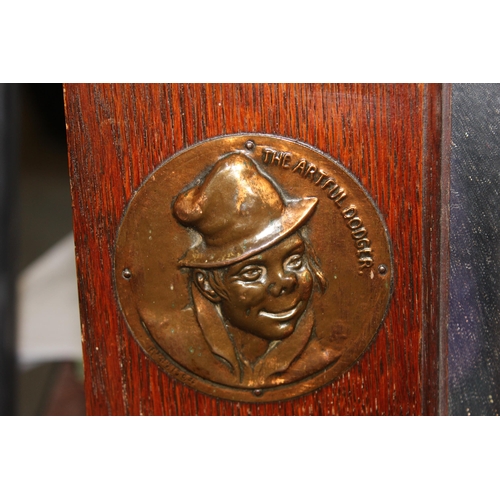 414 - Early 20th century oak framed mirror to feature two hammered-copper plaques The Artful Dodger and Sa... 