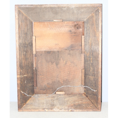 419 - A vintage mirror with thick rustic stained pine frame, approx 79cm x 61cm