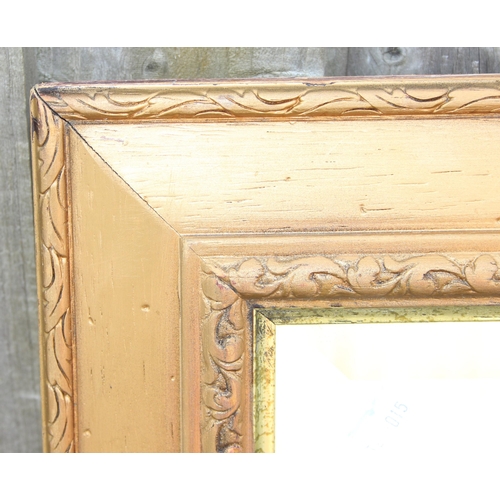 421 - 2 gilt framed mirrors, the largest approx 104cm x 73cm