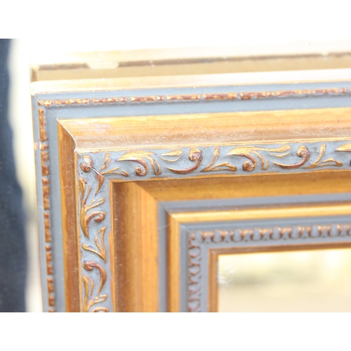 421 - 2 gilt framed mirrors, the largest approx 104cm x 73cm