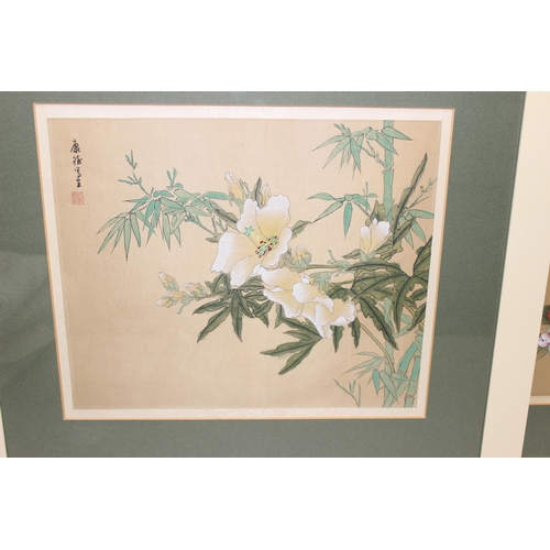 439 - 2 vintage Oriental paintings on fabric of flowers, each bearing Oriental character signatures, each ... 