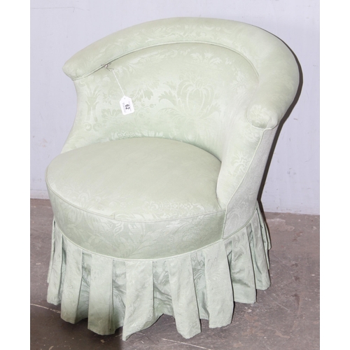 62 - A Victorian style cream upholstered nursing or low chair with turned wooden legs, approx 75cm wide x... 