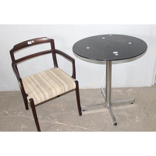 64 - An Ole Wanscher style retro armchair and a smoked glass with chrome base, the table approx 72cm wide... 