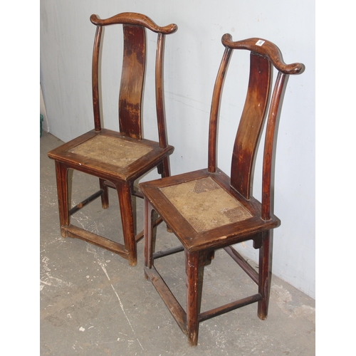 66 - A pair of Chinese Yoke back elm chairs, likely early 20th century, each approx 116cm tall