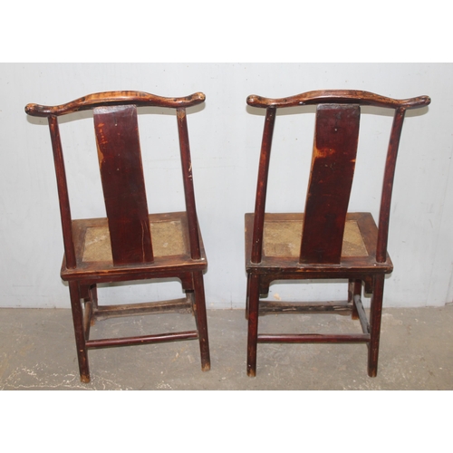 66 - A pair of Chinese Yoke back elm chairs, likely early 20th century, each approx 116cm tall