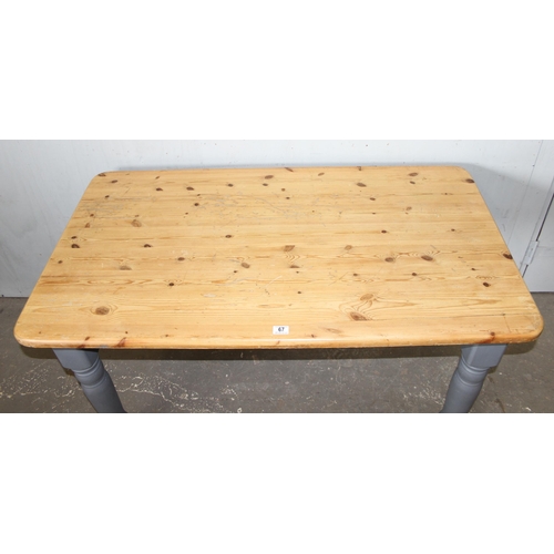 67 - A pine farmhouse kitchen table with scrub top and grey painted base, approx 135cm wide x 76cm deep x... 