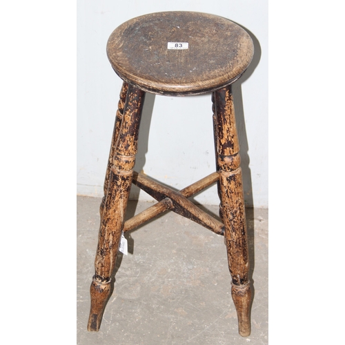 83 - An antique elm topped stool with turned legs, approx 34cm wide x 32cm deep x 60cm tall