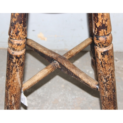 83 - An antique elm topped stool with turned legs, approx 34cm wide x 32cm deep x 60cm tall