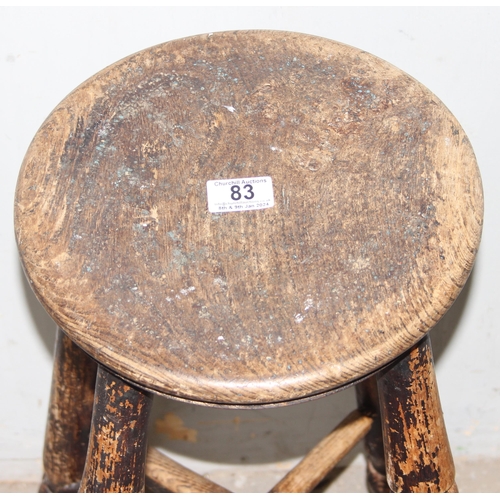 83 - An antique elm topped stool with turned legs, approx 34cm wide x 32cm deep x 60cm tall