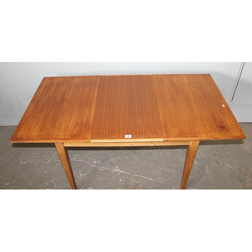 86 - Gordon Russell, a retro extending dining table, approx 153cm wide x 78cm deep x 77cm tall (108cm dee... 