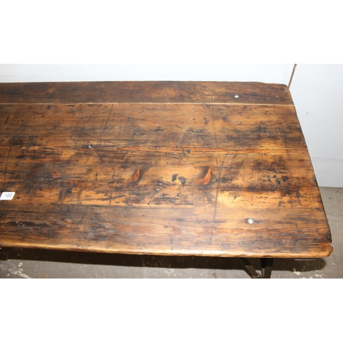 100 - A vintage wooden topped folding trestle table with metal base likely c.1930, approx 181cm wide x 68c... 