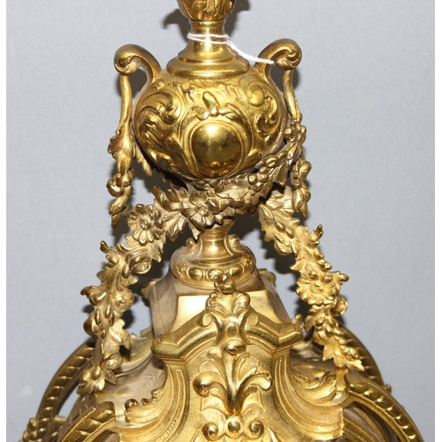 1321 - A highly decorative French brass clock garniture, a highly decorative Rococo style clock flanked by ... 