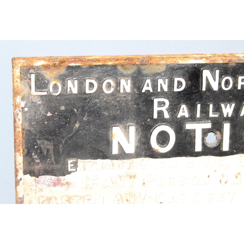 444 - Original cast iron London & North Western Railway penalty notice sign in black and white, dated 1883... 