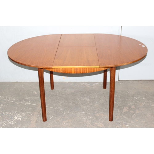 7 - A.H. McIntosh of Kirkcaldy, a retro extending dining table, approx 115cm wide x 115cm deep x 76cm ta... 