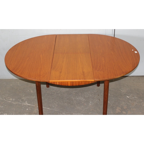 7 - A.H. McIntosh of Kirkcaldy, a retro extending dining table, approx 115cm wide x 115cm deep x 76cm ta... 