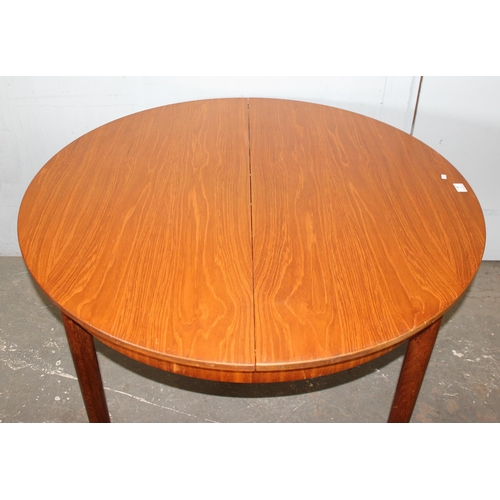 7 - A.H. McIntosh of Kirkcaldy, a retro extending dining table, approx 115cm wide x 115cm deep x 76cm ta... 