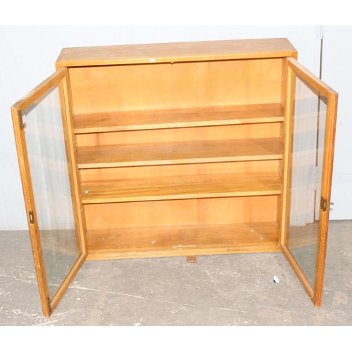 82 - A 1956 dated Air Ministry glazed light oak bookcase, approx 107cm wide x 25cm deep x 105cm tall