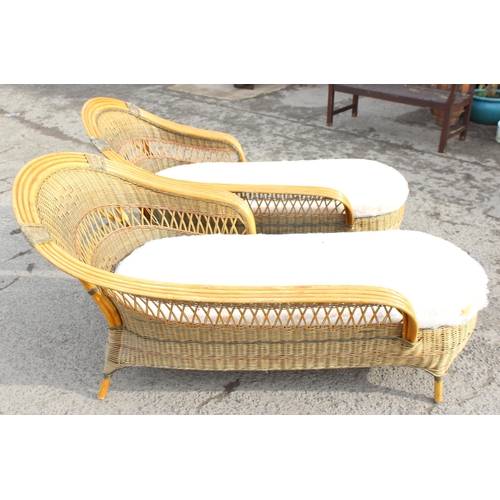 89 - A Pair of vintage wicker Loungers or chaises longues, each approx 175cm wide x 87cm deep x 90cm tall