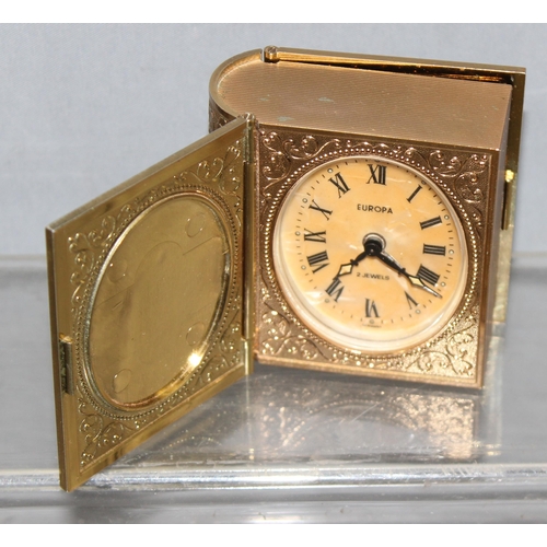 1322 - Vintage Swiza 8 day Swiss made mechanical bedside alarm clock, approx 11cm H, and a German made nove... 