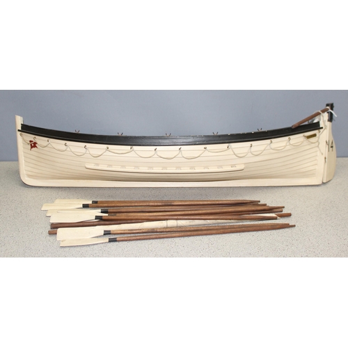 1533 - Wooden model of a vintage lifeboat with oars, approx 80cm W x 16cm H