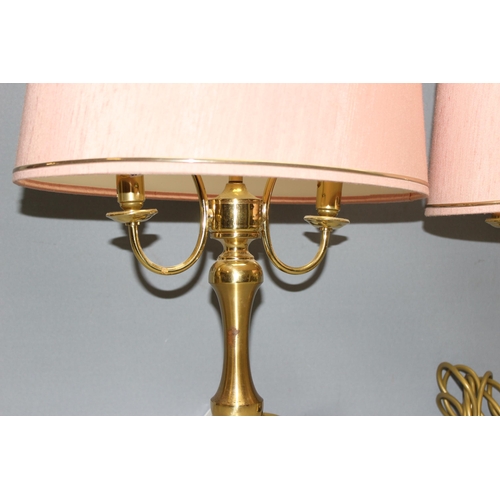 242 - Pair of dual-light brass table lamps with pink shades, approx 55cm