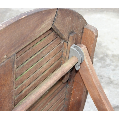 366 - A circular teak garden table and 2 directors style chairs, approx 108cm wide x 108cm deep x 74cm tal... 