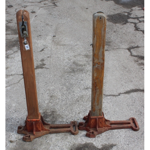 368 - A pair of vintage metal and wooden tennis net posts, approx 109cm tall