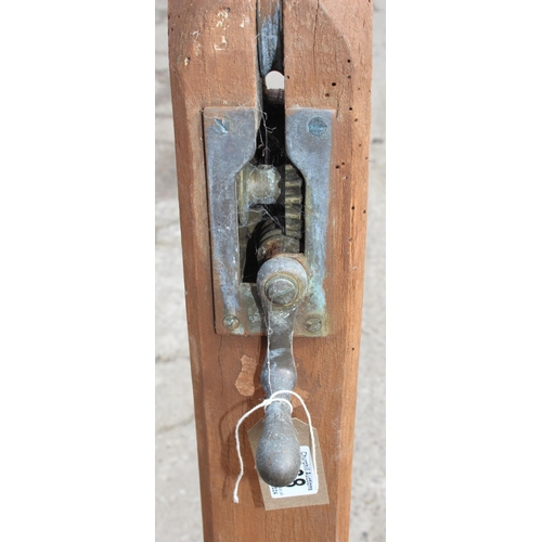 368 - A pair of vintage metal and wooden tennis net posts, approx 109cm tall