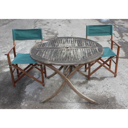 366 - A circular teak garden table and 2 directors style chairs, approx 108cm wide x 108cm deep x 74cm tal... 