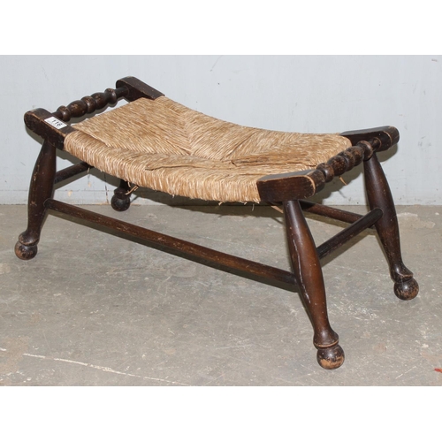 116 - An Arts & Crafts period oak and rush topped footstool, approx 65cm wide x 30cm deep x 34cm tall