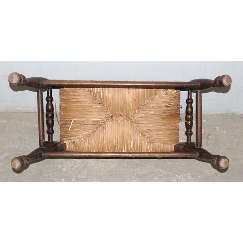 116 - An Arts & Crafts period oak and rush topped footstool, approx 65cm wide x 30cm deep x 34cm tall