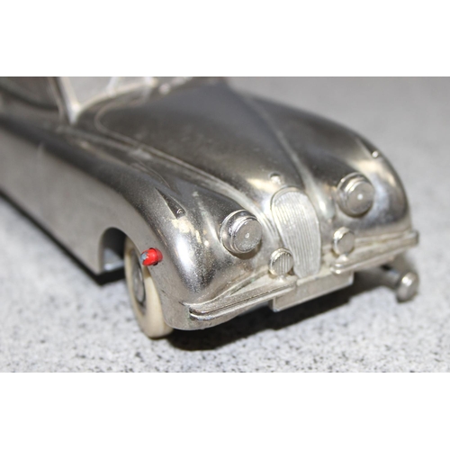 1540 - A rare vintage Prameta Kolner automodelle Jaguar XK120 model wind up car with key, approx 15cm long