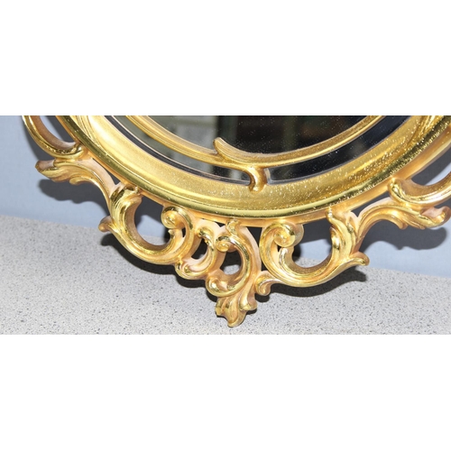 464 - Decorative ornate wall mirror, approx 74 x 46cm