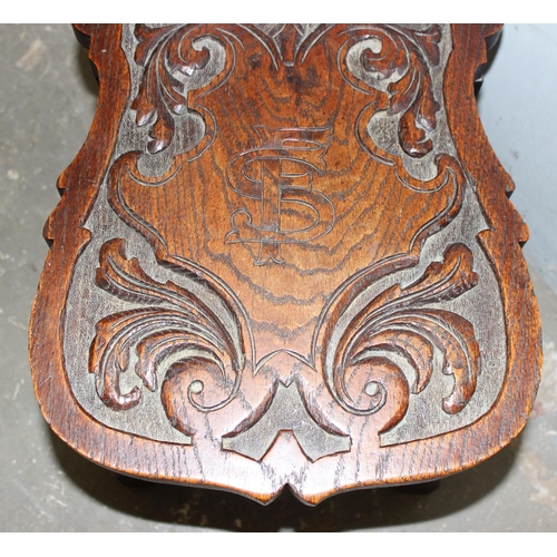 92 - A highly decorative 19th century carved oak hall chair, approx 35cm wide x 49cm deep x 87cm tall