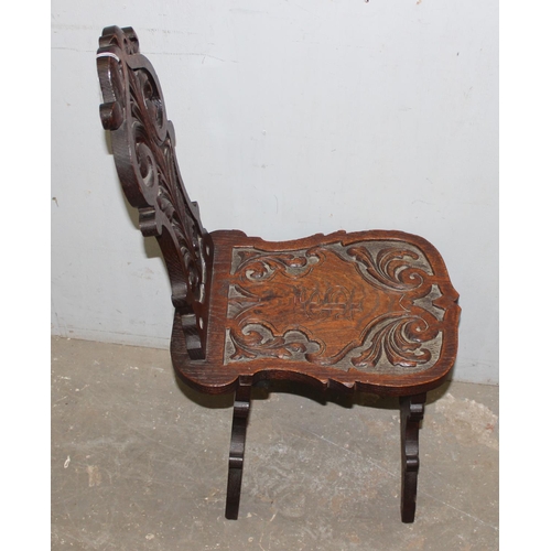 92 - A highly decorative 19th century carved oak hall chair, approx 35cm wide x 49cm deep x 87cm tall