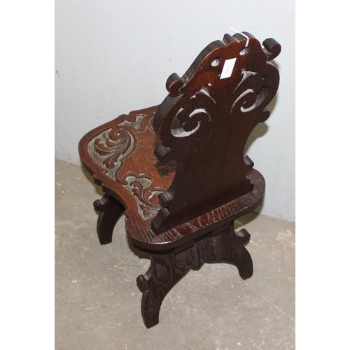 92 - A highly decorative 19th century carved oak hall chair, approx 35cm wide x 49cm deep x 87cm tall