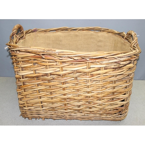 291 - Large wicker log/laundry basket with handles, approx 77cm x 67 x 52cm