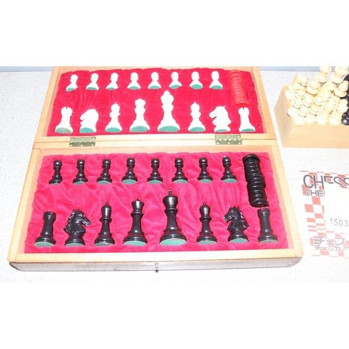 1551 - Boxed wooden chess set and board to incl draughts pieces, and a further chess set in wooden box