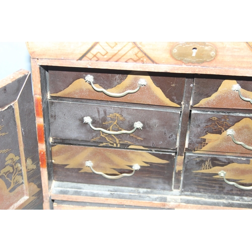 138 - Antique Japanese specimen wood inlaid table-top cabinet with drawers, with black lacquer and gilt de... 