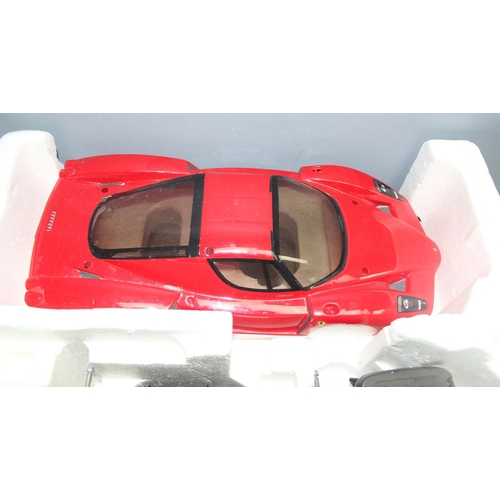 1554 - Nikko 1:14 scale Ferrari 10 piece R/c kit car with some original packaging and assorted remote contr... 