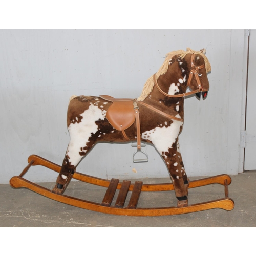 1562 - Child's stuffed rocking horse on wooden base, approx 144cm W x 104cm H x 38cm D